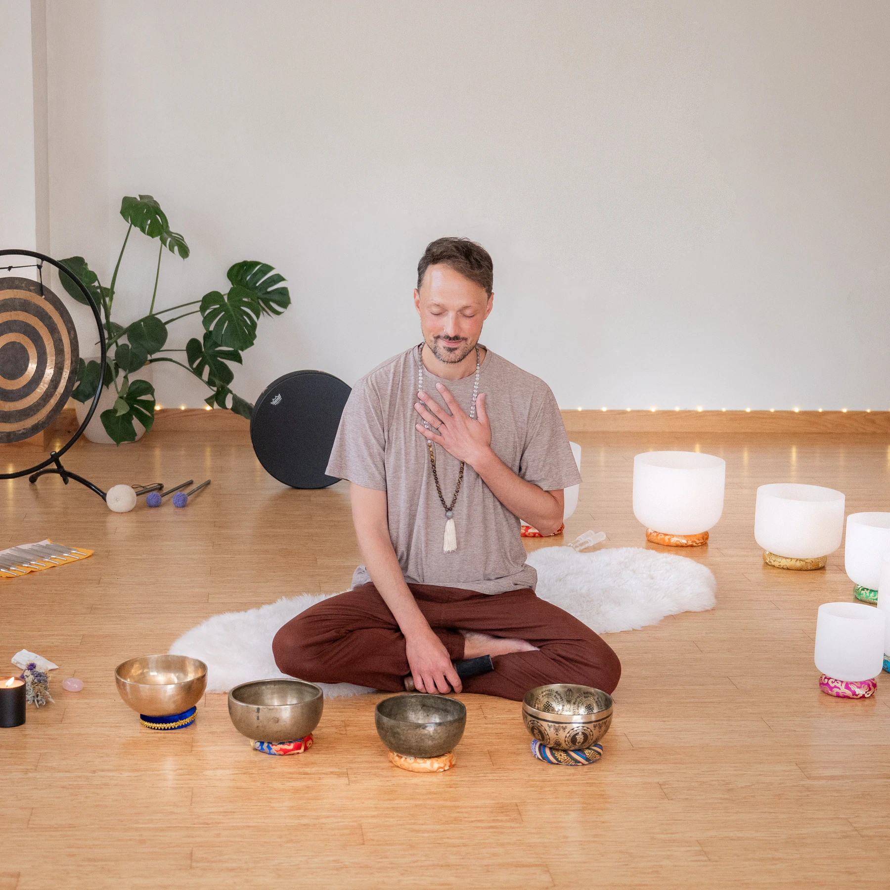 Matias surrounded by singing bowls